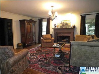 Spacious family room with a wood burning fireplace