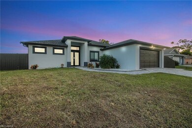 Prairie-style home featuring an attached garage, stucco siding, driveway, and a shingled roof