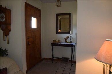 Entry hall with large coat closet.