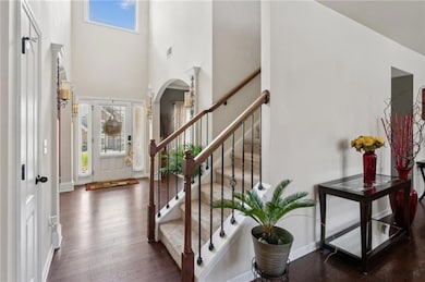 Entrance foyer featuring arched walkways, plenty o