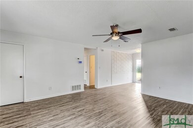 LIVING ROOM WITH NEW LVP FLOORING