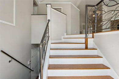 Stairs featuring crown molding