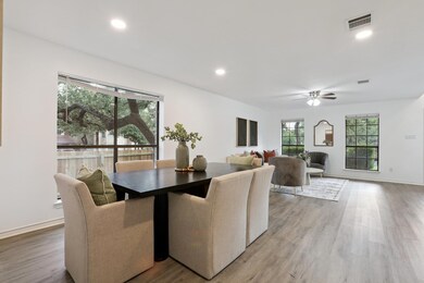 Dining space with light wood-style flooring, ceil
