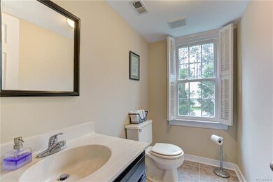 Generously sized half bath conveniently located.