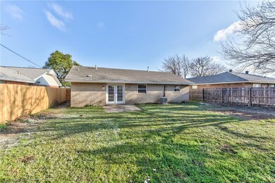 Large backyard with stockade fence fully surroundi