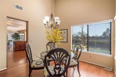 Dining room opens to both living room and kitchen.