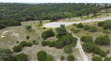 Aerial view of property's location with a forest