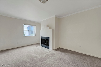 Unfurnished living room with crown molding, carpet
