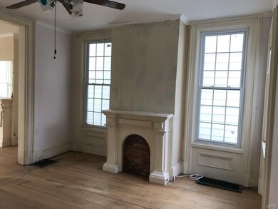 Dining room with decorative fireplace and ceiling 