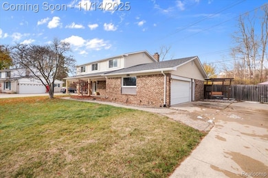 Traditional-style house featuring driveway, brick siding, a garage, a chimney, and covered porch