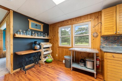 Office featuring wood finished floors and wood walls