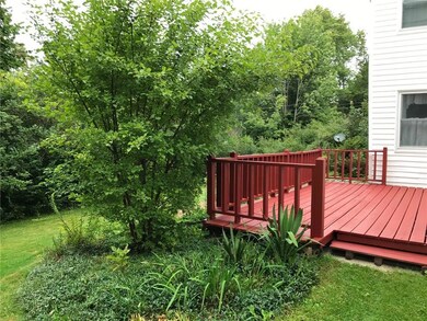 back and side of house with deck