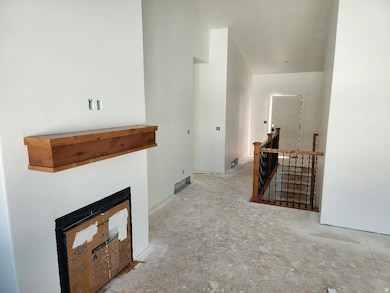 Hall featuring an upstairs landing