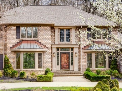 This all brick home has two front bay windows with