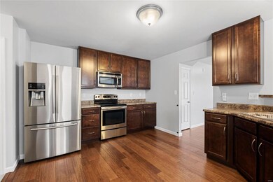 Stainless steel appliances and 42' tall cabinets a