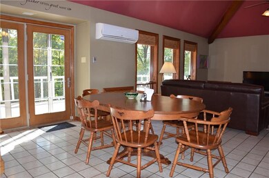 Dining room has ceramic floor and is completely op