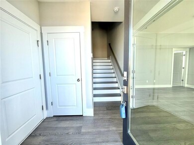 Stairs featuring wood finished floors