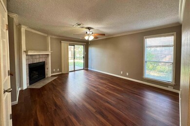 Unfurnished living room with crown molding, a fir