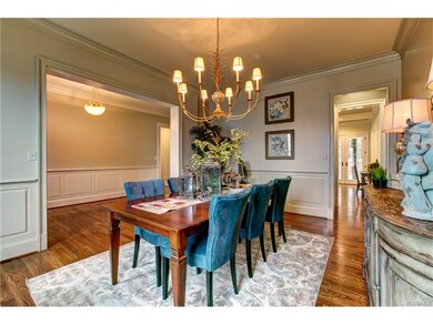 Dining Room with Wainscoting and Chandelier