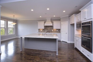 Kitchen  Photo is an Augusta II in a different Community. For representation only.