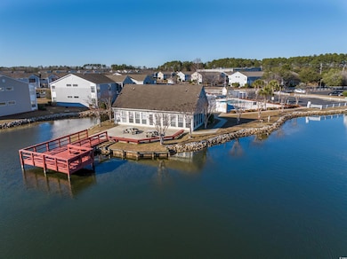Bird's eye view featuring a water view and a resid