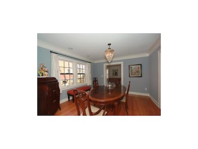 Lovely formal dining room has charm and lots of na