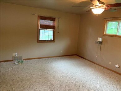 Master bedroom, carpeting and ceiling fan