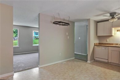 Looking toward eat-in area of kitchen and into fam