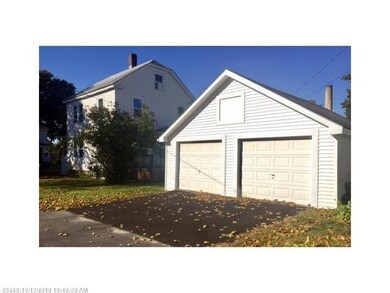 2-car garage with paved driveway