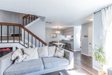Spacious, and open living and dining room and stai