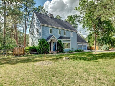 View of front of house featuring a garage and a fr