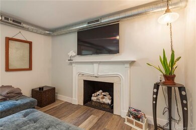 Gas fireplace with recently updated gas logs.