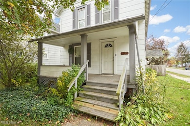 Entrance to property featuring a porch