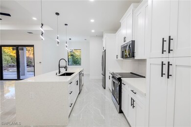 Kitchen featuring a sink, recessed lighting, a kit