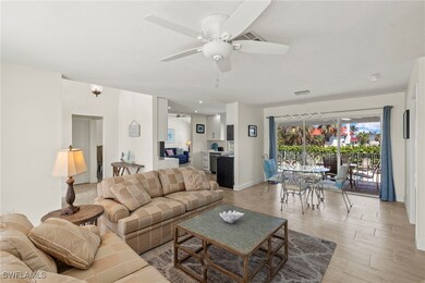 Living area with a ceiling fan, light wood-type fl