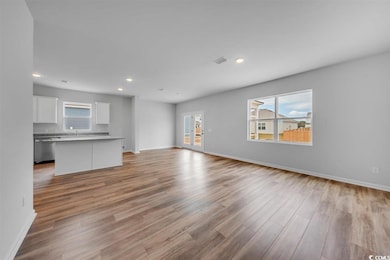 Unfurnished living room featuring visible vents, a
