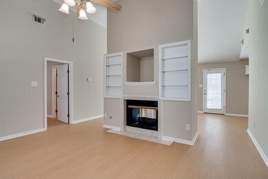 Great room with built in shelves and fireplace