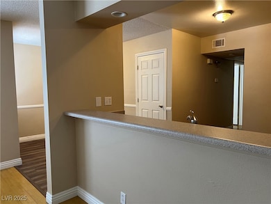 Kitchen featuring wood finished floors, baseboards