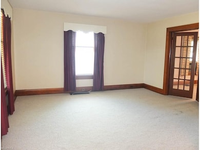 Spacious living room with French doors to the dini