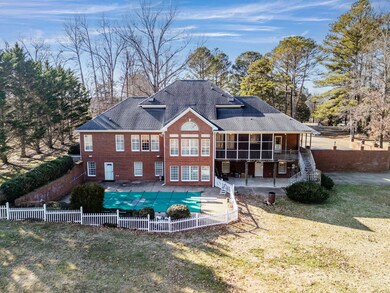 View of Pool and Back of Home