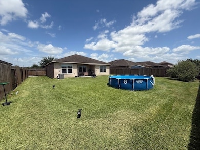 With a large, fenced backyard and an above ground