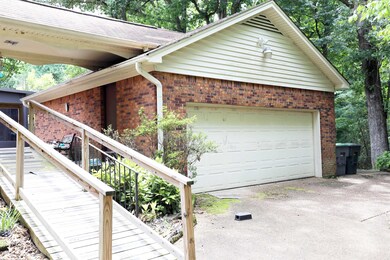 View of property exterior featuring a garage