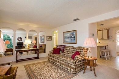 Designer mirrors along one wall provide expansive 