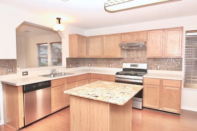 View of the island kitchen with stainless steel ap