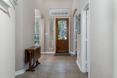 Welcome home! Leaded glass door with transom windows in the grand 2 story entry.