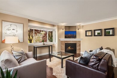 Showcase interior filled with gleaming hardwood flooring, crown molding, wood blinds throughout.