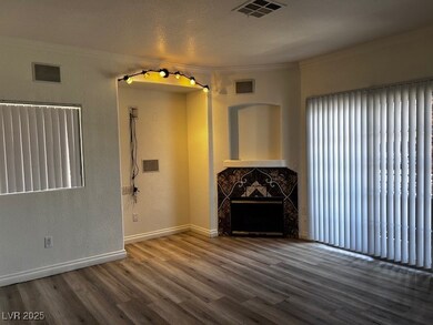 Unfurnished living room featuring crown molding, w