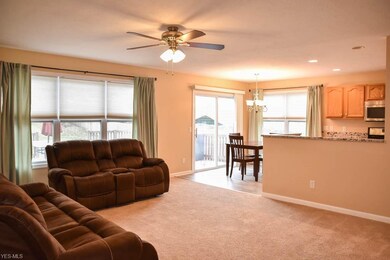 Open great room, dining and kitchen.
