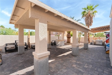 Fenced backyard with a patio area, a pergola, and a hot tub