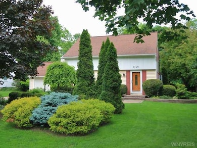 Exterior Front. Professional landscaping - just ma